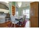 Stylish dining room features a decorative chandelier, hardwood floors, and adjacent kitchen at 121 St Albans Way, Peachtree City, GA 30269