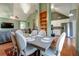 Elegant dining area with chandelier, hardwood floors, and connection to the kitchen and living room at 121 St Albans Way, Peachtree City, GA 30269
