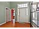 Inviting foyer with hardwood floors and a view into an adjacent bedroom at 121 St Albans Way, Peachtree City, GA 30269