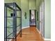 Hallway featuring hardwood flooring and stylish shelving at 121 St Albans Way, Peachtree City, GA 30269