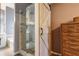 Elegant bathroom with a modern shower, wooden sliding door, and stylish tile work at 121 St Albans Way, Peachtree City, GA 30269
