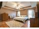 Comfortable main bedroom featuring trey ceilings, ceiling fan, and plush carpet at 121 St Albans Way, Peachtree City, GA 30269