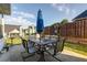 Relaxing backyard patio setting with table and chairs; great for outdoor dining at 121 St Albans Way, Peachtree City, GA 30269