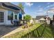Charming patio with dining set, lush greenery, and a well-maintained backyard at 121 St Albans Way, Peachtree City, GA 30269