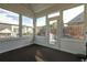 Sunroom featuring many windows providing natural light and backyard views of the neighborhood at 121 St Albans Way, Peachtree City, GA 30269