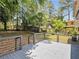 Backyard deck showcasing rod railing and a spacious backyard with mature trees at 2247 Green Forrest Dr, Decatur, GA 30032