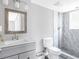 Updated bathroom featuring a modern vanity, framed mirror, and a glass shower with unique tile work at 2247 Green Forrest Dr, Decatur, GA 30032