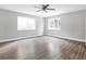 Large, bright bedroom with hardwood floors, neutral paint and lots of natural light from updated windows at 2247 Green Forrest Dr, Decatur, GA 30032