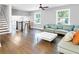 Spacious living room with light gray walls, hardwood floors, modern lighting, and lots of natural light at 2247 Green Forrest Dr, Decatur, GA 30032