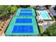 Aerial view of tennis courts and a large community swimming pool at 500 Birch Forest Ln, Alpharetta, GA 30005