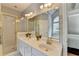 Bathroom featuring double sink vanity, glass-enclosed shower and soaking tub at 500 Birch Forest Ln, Alpharetta, GA 30005