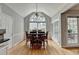 Dining room featuring cathedral ceiling, large windows, and hardwood floors at 500 Birch Forest Ln, Alpharetta, GA 30005