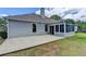 Home exterior with patio and sunroom, set on a well-kept lawn at 500 Birch Forest Ln, Alpharetta, GA 30005