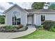 Inviting front entrance with a decorative door, arched window and neatly landscaped yard at 500 Birch Forest Ln, Alpharetta, GA 30005