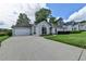 Lovely one-story home with an attached two-car garage and a large driveway at 500 Birch Forest Ln, Alpharetta, GA 30005