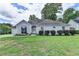 Charming one-story home with large arched windows and well-maintained landscaping at 500 Birch Forest Ln, Alpharetta, GA 30005