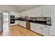 Bright and modern kitchen with stainless steel appliances and white cabinetry at 500 Birch Forest Ln, Alpharetta, GA 30005