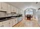 Large kitchen featuring white cabinets, stainless appliances and connecting dining area at 500 Birch Forest Ln, Alpharetta, GA 30005