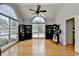 Bright living room features hardwood floors, high ceilings, and large windows at 500 Birch Forest Ln, Alpharetta, GA 30005