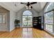 Bright living room features hardwood floors, high ceilings, and large windows at 500 Birch Forest Ln, Alpharetta, GA 30005