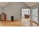 Living room featuring hardwood floors and an open layout leading to dining at 500 Birch Forest Ln, Alpharetta, GA 30005