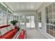 Comfortable sunroom with plush carpet, large windows, and sliding doors to the outdoors at 500 Birch Forest Ln, Alpharetta, GA 30005