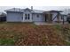 Backyard with a covered patio area and view of the home's siding, windows, and roof at 563 Fieldgreen Dr, Jonesboro, GA 30238