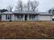 Charming single-story home with a covered front porch and attached garage at 563 Fieldgreen Dr, Jonesboro, GA 30238