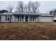 Charming one-story home featuring covered porch and large, level front yard at 563 Fieldgreen Dr, Jonesboro, GA 30238