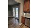 Kitchen featuring wood cabinets and granite countertops, alongside stainless steel dishwasher at 563 Fieldgreen Dr, Jonesboro, GA 30238