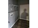 Interior laundry room with grey walls and laminate flooring at 563 Fieldgreen Dr, Jonesboro, GA 30238