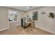 Basement bar area with seating and a view into the adjacent room at 7014 E Hills Way, Woodstock, GA 30189