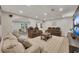 Finished basement living room with comfortable seating and modern decor, perfect for entertainment at 7014 E Hills Way, Woodstock, GA 30189