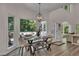 Bright dining area with modern table set, plenty of natural light and deck access at 7014 E Hills Way, Woodstock, GA 30189