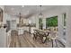 Charming dining area with a view of the backyard and modern decor at 7014 E Hills Way, Woodstock, GA 30189