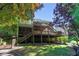 Multi-level deck overlooking landscaped yard and lush trees, creating a perfect outdoor oasis at 7014 E Hills Way, Woodstock, GA 30189