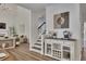 Hallway with modern decor leading to living room and stairs at 7014 E Hills Way, Woodstock, GA 30189