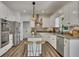 Modern kitchen with stainless steel appliances and granite countertops at 7014 E Hills Way, Woodstock, GA 30189