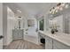 Bathroom with double vanity sinks, soaking tub and tile floors at 7014 E Hills Way, Woodstock, GA 30189
