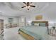 Large primary bedroom with seating and adjoining bath at 7014 E Hills Way, Woodstock, GA 30189