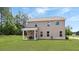 Large backyard featuring a covered patio seating area and expansive green space at 20 Geranium Ln, Covington, GA 30016