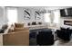 Bright living room features large windows, stylish furniture, a modern fireplace, and contemporary art at 20 Geranium Ln, Covington, GA 30016