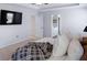 Spacious main bedroom with a large tv, tray ceiling, plush carpeting, and an ensuite bathroom at 20 Geranium Ln, Covington, GA 30016