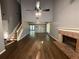 Spacious living room featuring hardwood floors, a fireplace, and high ceilings at 2032 Hopkins Mill Road, Duluth, GA 30096