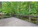 Spacious wood back deck overlooking a lush, wooded backyard at 2967 Albright Cmns, Kennesaw, GA 30144