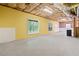Unfinished basement area with painted walls, windows, and exposed ceiling insulation at 2967 Albright Cmns, Kennesaw, GA 30144