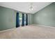 Spacious bedroom with tall ceilings, carpeted flooring, and a large window with curtains for natural light at 2967 Albright Cmns, Kennesaw, GA 30144