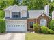 Charming two-story home with a brick facade, attached garage, and well-maintained landscaping at 2967 Albright Cmns, Kennesaw, GA 30144
