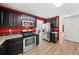 Modern kitchen features black cabinets, stainless steel appliances, granite countertops, and stylish backsplash at 2967 Albright Cmns, Kennesaw, GA 30144