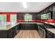 Well-appointed kitchen with granite countertops, dark cabinets, and stainless steel appliances at 2967 Albright Cmns, Kennesaw, GA 30144